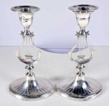A Pair of Victorian Silver Lyre Candlesticks (with weighted bottoms) by Hawksworth, Eyre & Co Ltd.
