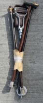 A collection of walking canes and a shooting stick 89 cm (5)