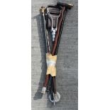 A collection of walking canes and a shooting stick 89 cm (5)