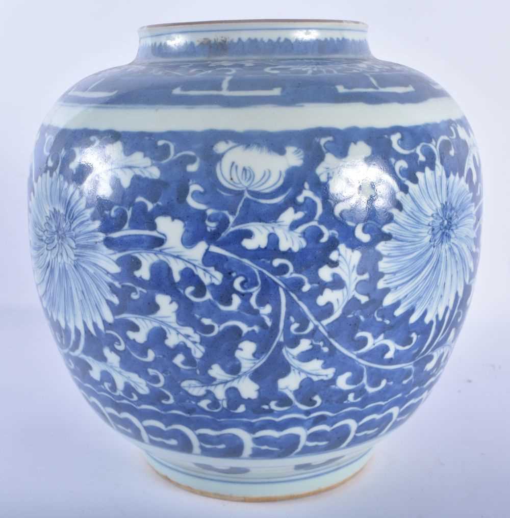 A CHINESE QING DYNASTY BLUE AND WHITE PORCELAIN VASE painted with flowers. 22 cm x 19 cm. - Image 2 of 4
