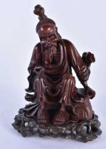 A 19TH CENTURY CHINESE CARVED HARDWOOD FIGURE OF A MALE Qing. 25cm x 14 cm.