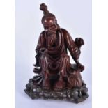 A 19TH CENTURY CHINESE CARVED HARDWOOD FIGURE OF A MALE Qing. 25cm x 14 cm.