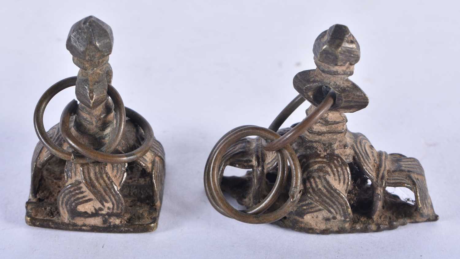 Two Early Bronze Seals. Largest 4cm x 3 cm x 2.5 cm, total weight 65.1g (2)