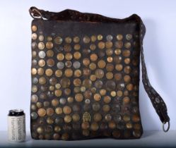 A Moroccan water sellers bag decorated with French coins 47 x 44 cm .