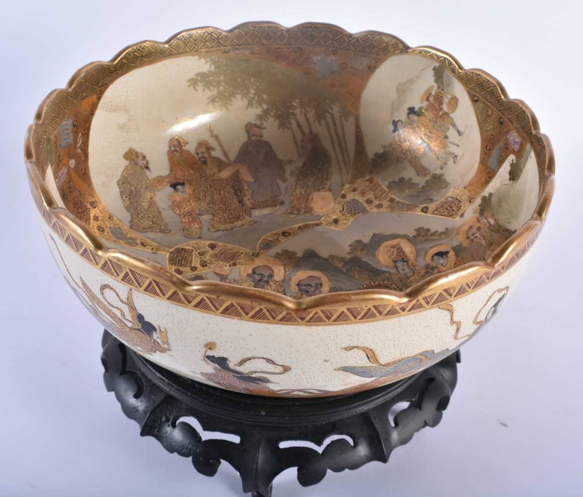 A LARGE LATE 19TH CENTURY JAPANESE MEIJI PERIOD SATSUMA BOWL painted with figures within landscapes. - Image 2 of 5