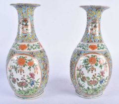 A PAIR OF 19TH CENTURY CHINESE FAMILLE ROSE STRAITS PORCELAIN VASES Qing, painted with flowers. 19