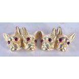 A Pair of Gold Dog Head Cufflinks with Gem Set Eyes. Stamped 84, 1.5 cm x 1.3 cm, weight 12.1g