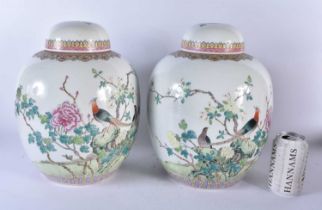 A LARGE PAIR OF EARLY 20TH CENTURY CHINESE FAMILLE ROSE GINGER JARS AND COVERS Late Qing/Republic.