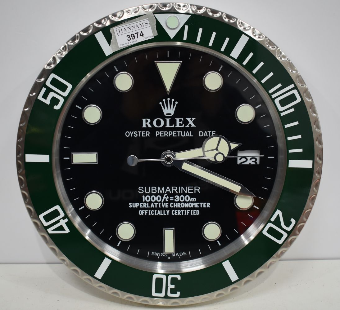 A Contemporary Rolex style dealership clock 33 cm.