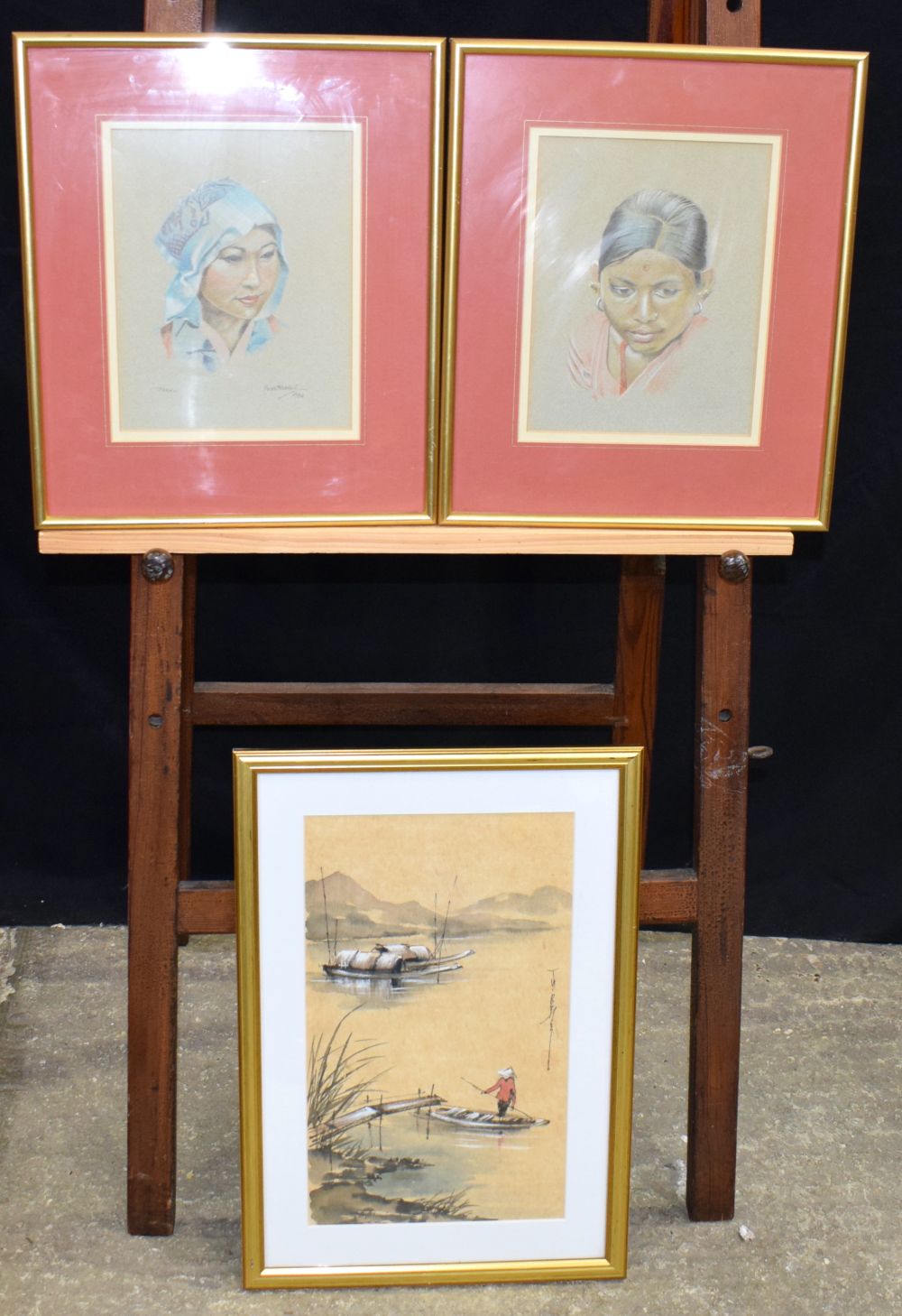 A pair of framed pastel portraits of Southeast Asian females together with a south East Asian