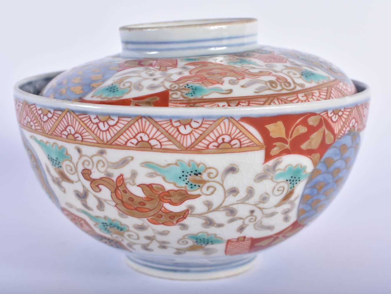 A 19TH CENTURY JAPANESE MEIJI PERIOD IMARI BOWL AND COVER painted with beasts and foliage. 10 cm - Image 2 of 4