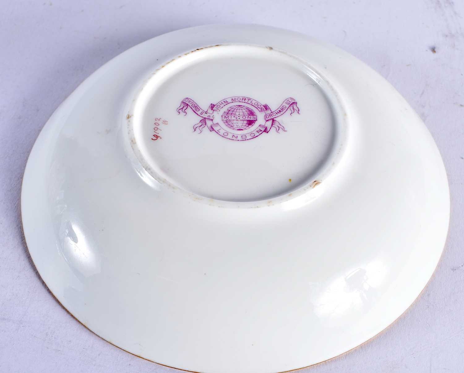 Minton teacup and saucer painted with a naked baby laying on a straw mattress, globe mark, made - Image 18 of 19