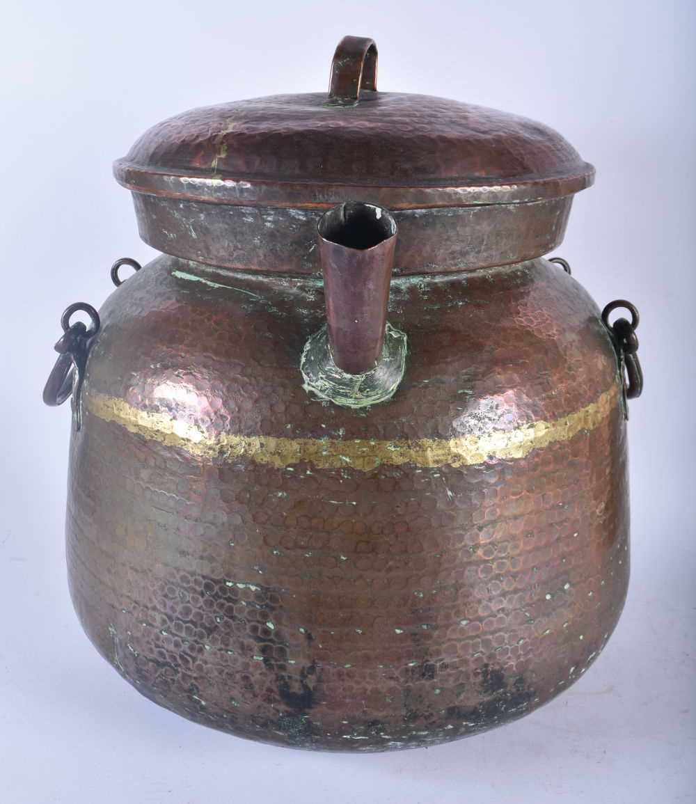 A LARGE EARLY 20TH CENTURY MALAYSIAN HAMMERED COPPER COOKING POT together with other dishes & a - Image 3 of 7