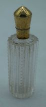 A 14CT GOLD AND GLASS SCENT BOTTLE. 43 grams. 8.75 cm x 2.75 cm.