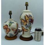 A large Moorcroft butterfly pattern lamp base together with a smaller moorcroft lamp base