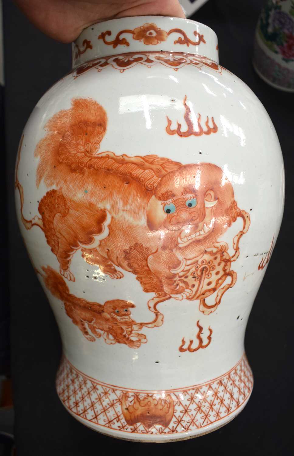 A LARGE PAIR OF CHINESE QING DYNASTY IRON RED PAINTED GINGER JARS AND COVERS painted with buddhistic - Image 14 of 26