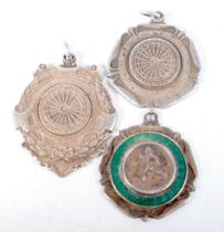 Three Sporting Medallions (Darts and Running). Largest 4.2 cm x 3.4cm (3)