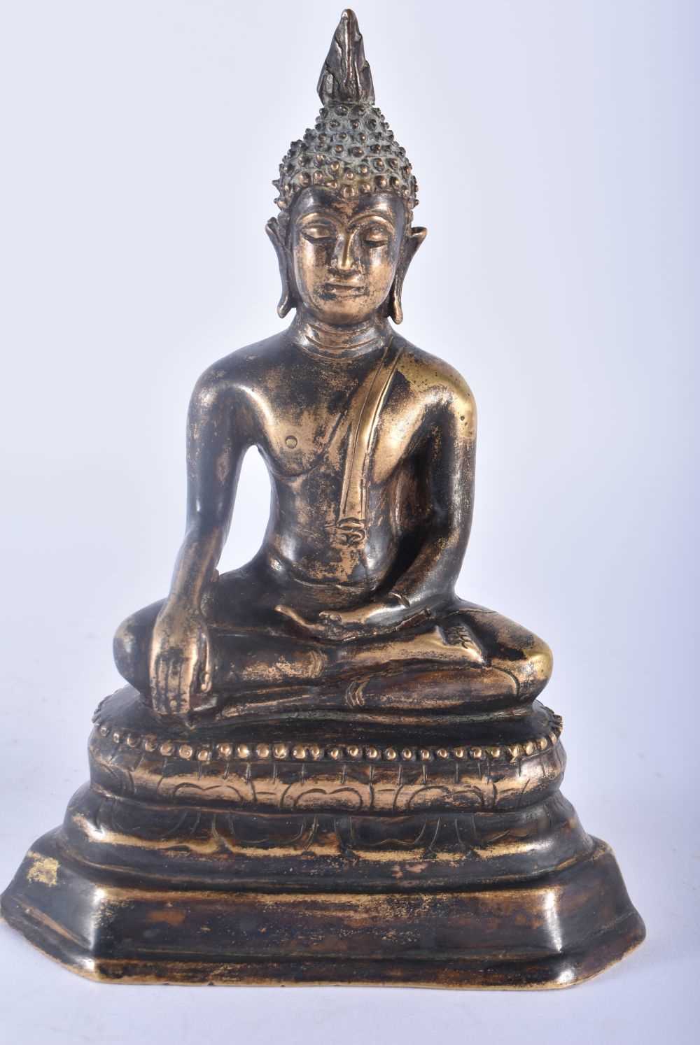 A 19TH CENTURY SOUTH EAST ASIAN THAI INDIAN BRONZE FIGURE OF A BUDDHA modelled seated upon a