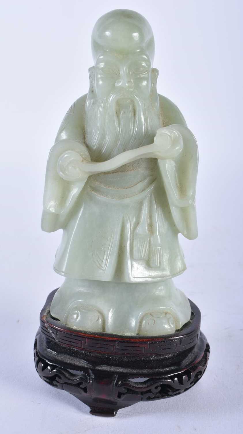 AN EARLY 20TH CENTURY CHINESE CARVED GREEN JADE FIGURE OF AN IMMORTAL Late Qing/Republic. 17 cm x