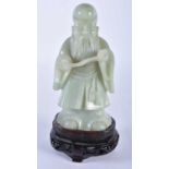 AN EARLY 20TH CENTURY CHINESE CARVED GREEN JADE FIGURE OF AN IMMORTAL Late Qing/Republic. 17 cm x