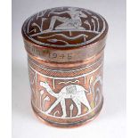 An Egyptian Copper Box and Cover with Silver Inlay figures. Engraved Cairo 1945. 10cm x 7.8 cm,