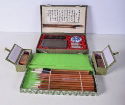 A Chinese Calligraphy set together with related seals and scholars pens 25 x 15 cm. (4).