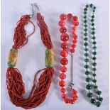 A CORAL NECKLACE together with a malachite necklace & another. Largest 56 cm long. (3)