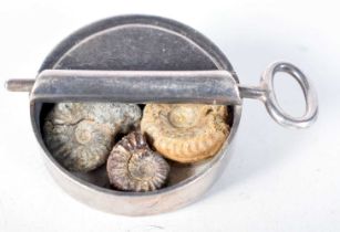 "Opening a Tin of Fossils" Novelty Silver Brooch. Stamped 925, 5.3 cm x 3.6 cm x 1.5 cm, weight 37.