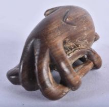 A Japanese Hardwood Netsuke carved as an Octopus. 5 cm x 3.2 cm x 2.9cm, weight 19.6g