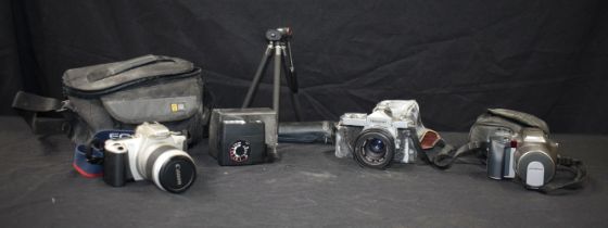 A collection of Cameras, Nikomat FT , Olympus IS 300, Cannon EOS 300 together with Accessories (5).