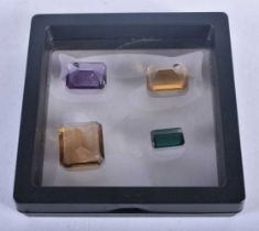 Four Encapsulated Gems. Largest 2 cm x 1.9cm x 0.8 cm