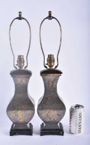 A LARGE PAIR OF 19TH CENTURY CHINESE PEWTER LAMPS Qing, decorated with figures, birds and foliage.