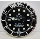 A Contemporary Rolex style dealership clock 33 cm.