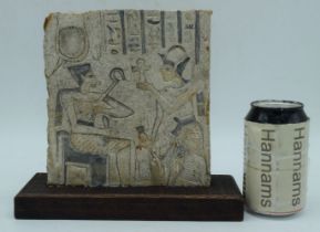 A mounted Egyptian carved Limestone relief 19 x 17 cm.