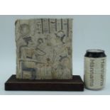 A mounted Egyptian carved Limestone relief 19 x 17 cm.