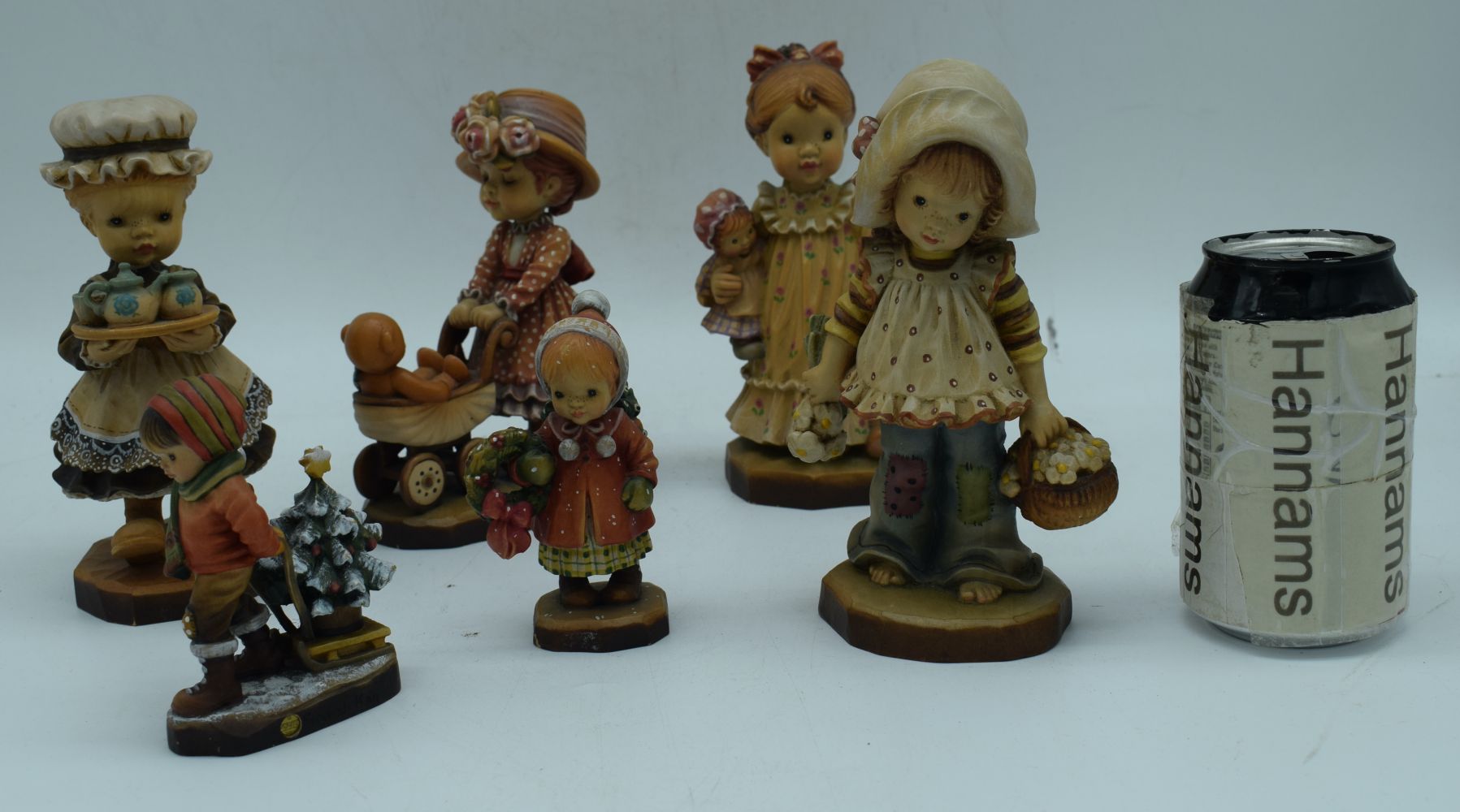 A collection of Italian carved wood ANRI figures largest 17 cm (6).