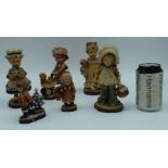 A collection of Italian carved wood ANRI figures largest 17 cm (6).
