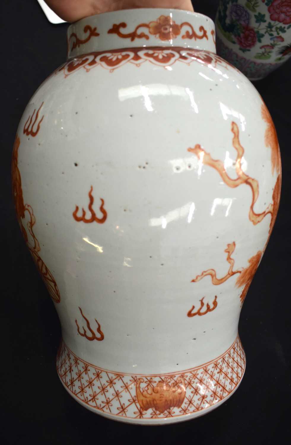 A LARGE PAIR OF CHINESE QING DYNASTY IRON RED PAINTED GINGER JARS AND COVERS painted with buddhistic - Image 15 of 26