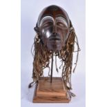 A LARGE EARLY 20TH CENTURY AFRICAN TRIBAL WOOD MASK with later stand. 48 cm x 15 cm.
