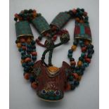 AN UNUSUAL TIBETAN TURQUOISE AMBER AND CORAL NECKLACE. 131 grams. 54 cm long.
