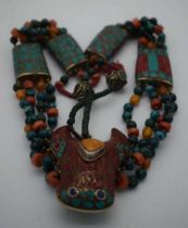 AN UNUSUAL TIBETAN TURQUOISE AMBER AND CORAL NECKLACE. 131 grams. 54 cm long.