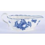AN 18TH CENTURY CAUGHLEY BLUE AND WHITE PORCELAIN SAUCE BOAT decorated with fruiting vines upon a