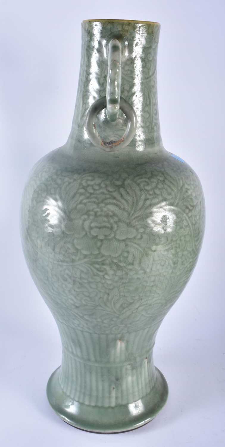 A LARGE 18TH/19TH CENTURY CHINESE TWIN HANDLED CELADON VASE decorated with foliage and vines. 54 - Image 2 of 12