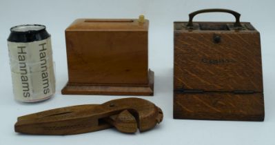 A mid Century oak and brass cigarette box together with a Satinwood cigarette dispenser and a carved