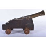 AN ANTIQUE COUNTRY HOUSE GENTLEMANS BRONZE DESK CANNON. 25cm long.