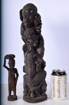 An African Makonde Carved Ebony "Tree of Life " sculpture together with a smaller Tribal carving