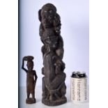 An African Makonde Carved Ebony "Tree of Life " sculpture together with a smaller Tribal carving