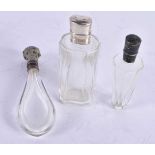 THREE ANTIQUE FRENCH SILVER MOUNTED SCENT BOTTLES. 121 grams overall. Largest 11cm high. (3)