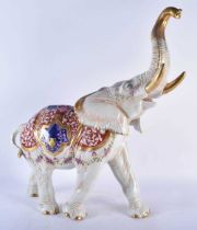 A VERY LARGE LATE 19TH CENTURY GERMAN DRESDEN PORCELAIN FIGURE OF AN ELEPHANT painted with flowers