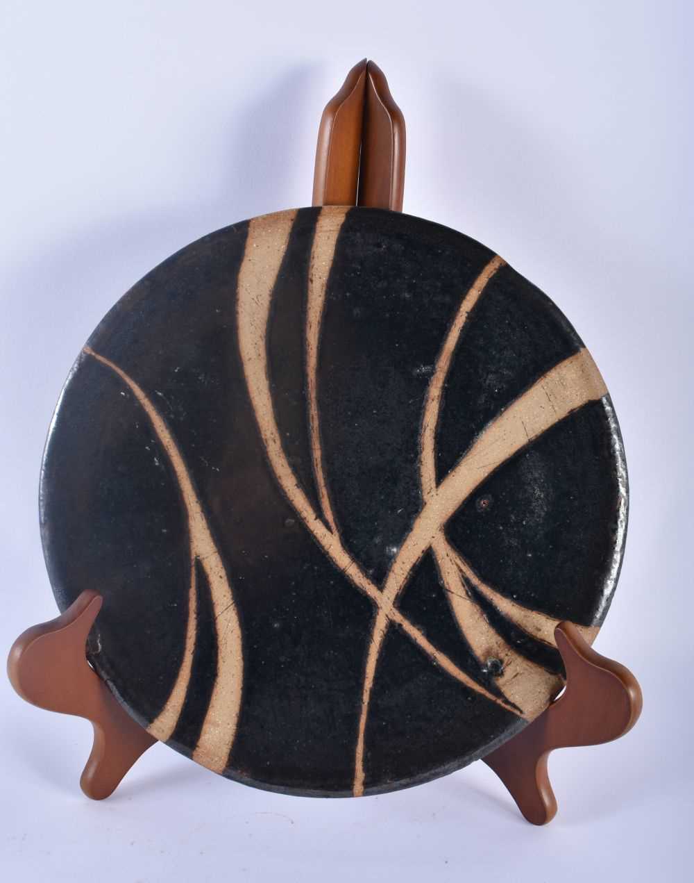 A FINE STUDIO POTTERY STONEWARE CIRCULAR DISH in the manner of Shoji Hamada (1894-1978). 28 cm